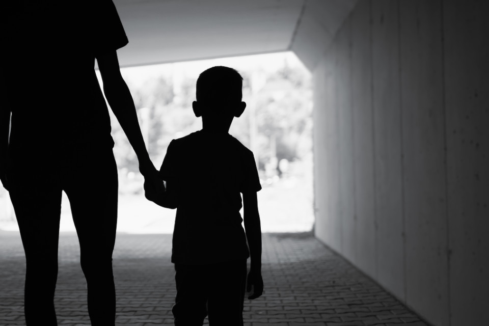 Parent and child in shadow